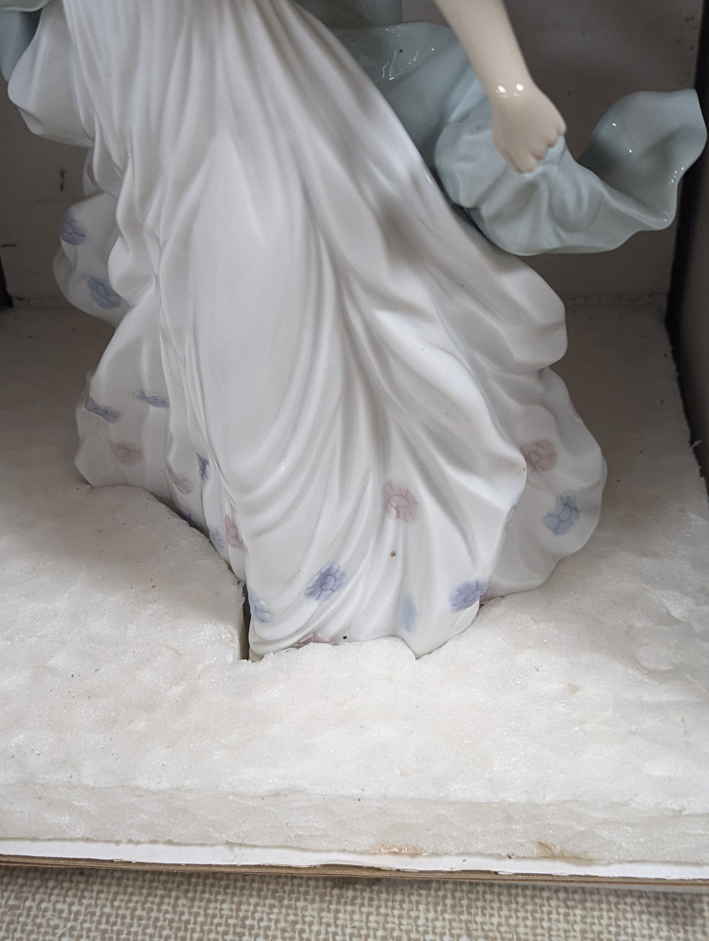 A selection of Lladro and Nao figures